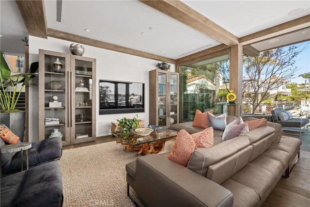 504 Evening Star Ln, Newport Beach, CA 92660 - living area featuring expansive windows, wood finished floors, beam ceiling, and a healthy amount of sunlight