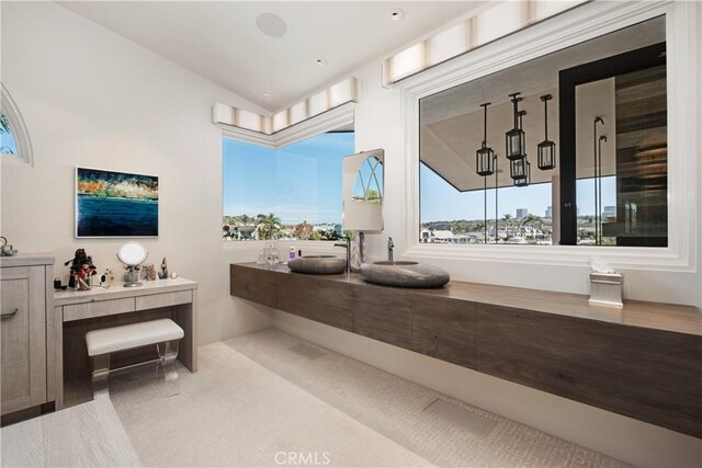 504 Evening Star Ln, Newport Beach, CA 92660 - full bathroom featuring lofted ceiling, vanity, and a healthy amount of sunlight