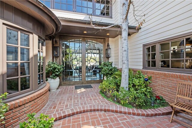 504 Evening Star Ln, Newport Beach, CA 92660 - property entrance with french doors and brick siding