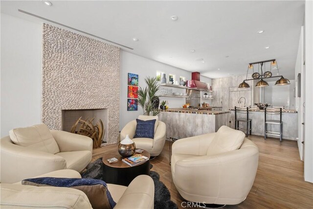 504 Evening Star Ln, Newport Beach, CA 92660 - living area featuring recessed lighting, a fireplace, and wood finished floors