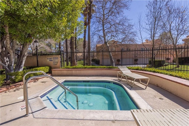 25214 Steinbeck Ave Unit G, Stevenson Ranch, CA 91381 - view of swimming pool featuring fence and a hot tub