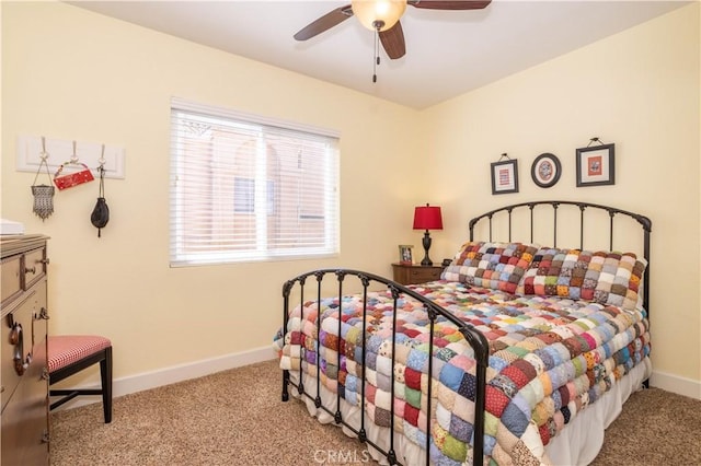 carpeted bedroom with a ceiling fan and baseboards