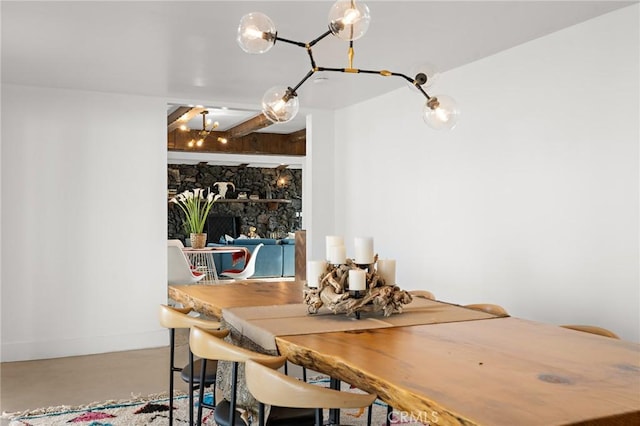 dining room with finished concrete floors and baseboards