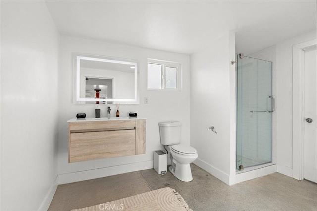 full bathroom with toilet, a shower stall, concrete floors, and baseboards