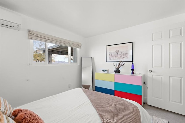 bedroom with an AC wall unit