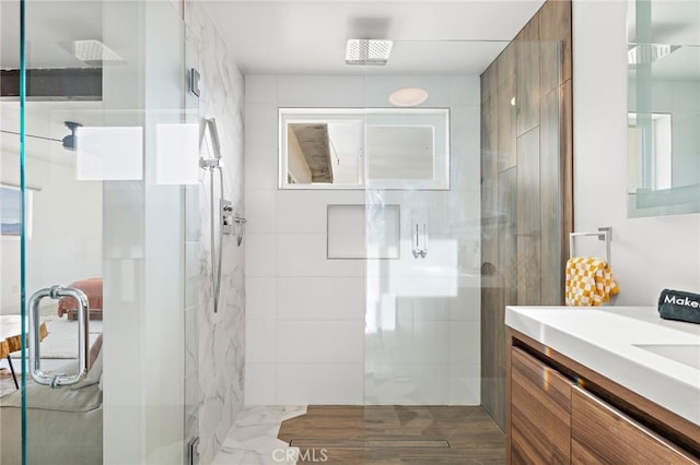 full bath featuring a shower stall and vanity