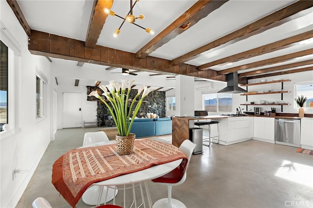 dining area featuring finished concrete flooring, a chandelier, and beam ceiling