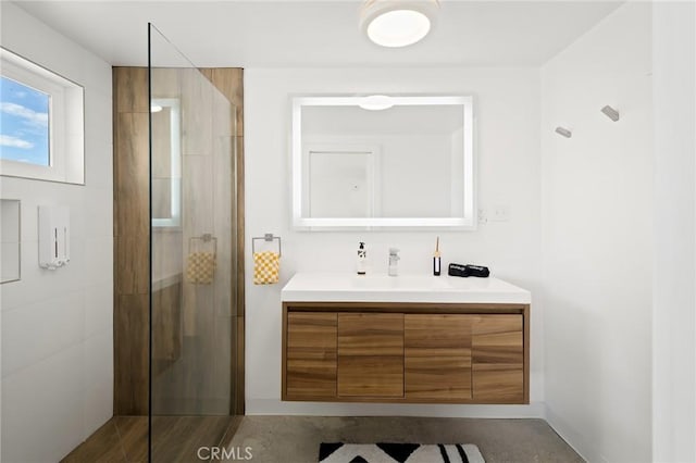 full bath featuring a stall shower and vanity