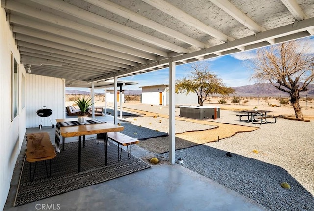 view of patio / terrace featuring a mountain view