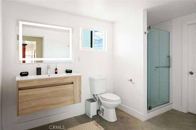 full bathroom with baseboards, a shower stall, toilet, and vanity