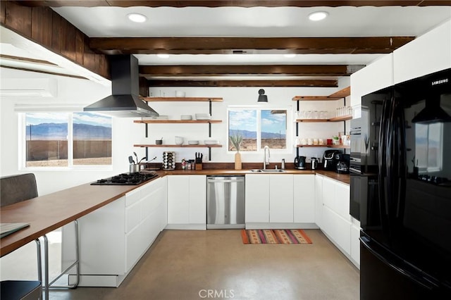 kitchen with open shelves, a sink, concrete floors, black appliances, and exhaust hood