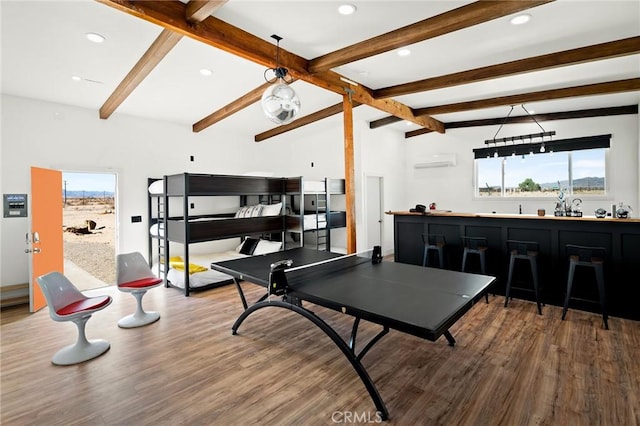 game room with a wall unit AC, wood finished floors, vaulted ceiling with beams, indoor wet bar, and recessed lighting