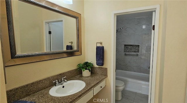 bathroom featuring marble finish floor, vanity, toilet, and bathtub / shower combination