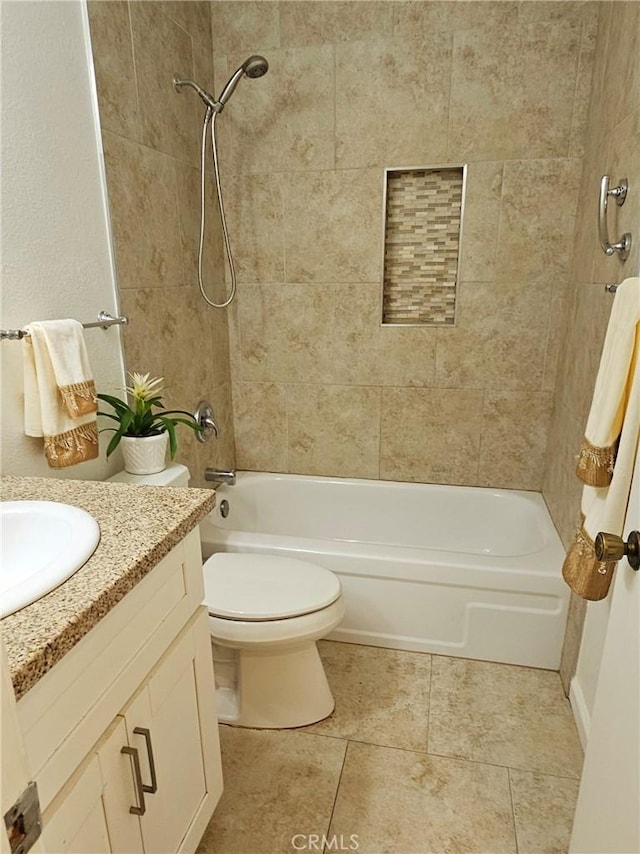 bathroom featuring toilet, vanity, bathing tub / shower combination, and tile patterned floors