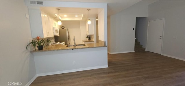 5440 Baltimore Dr Unit 144, La Mesa, CA 91942 - kitchen featuring a sink, white appliances, dark wood finished floors, white cabinets, and a peninsula