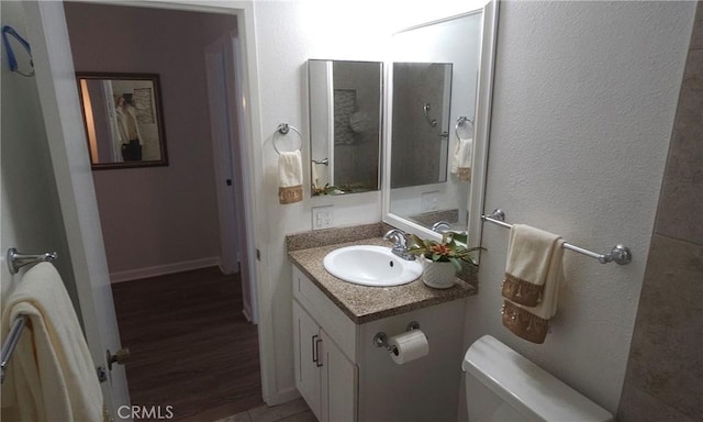 5440 Baltimore Dr Unit 144, La Mesa, CA 91942 - bathroom with toilet, vanity, and wood finished floors