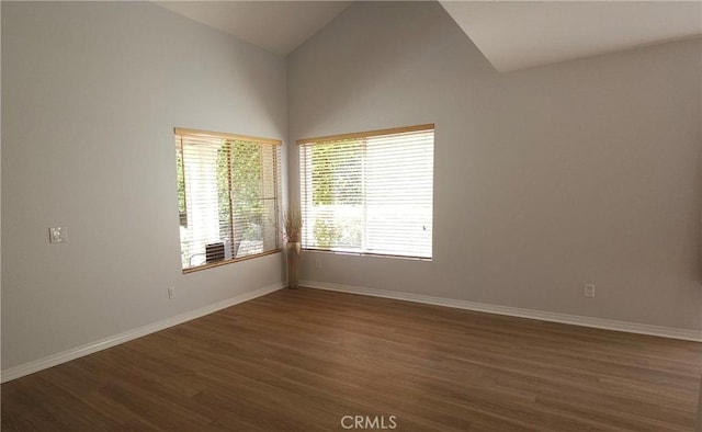 5440 Baltimore Dr Unit 144, La Mesa, CA 91942 - spare room featuring lofted ceiling, dark wood-type flooring, healthy amount of natural light, and baseboards