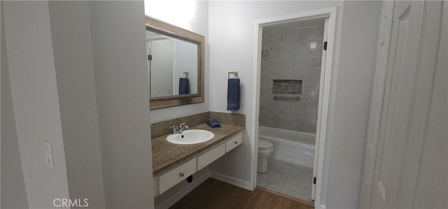 5440 Baltimore Dr Unit 144, La Mesa, CA 91942 - bathroom with toilet, vanity, washtub / shower combination, and marble look tile flooring