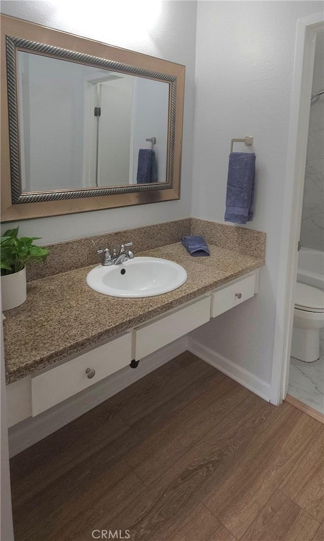 5440 Baltimore Dr Unit 144, La Mesa, CA 91942 - full bath featuring toilet, vanity, wood finished floors, and baseboards
