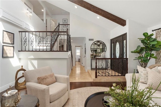 living area featuring recessed lighting, visible vents, wood finished floors, beamed ceiling, and stairs