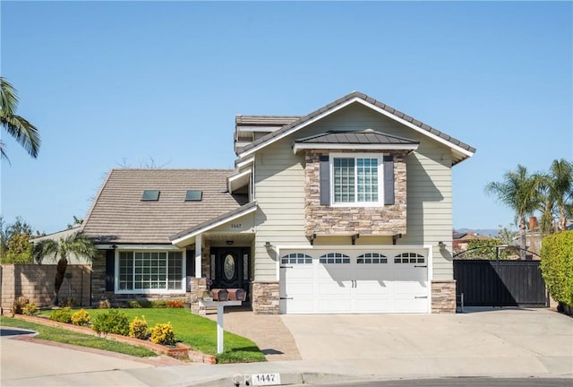 view of front of home featuring a tile roof, concrete driveway, fence, a garage, and stone siding