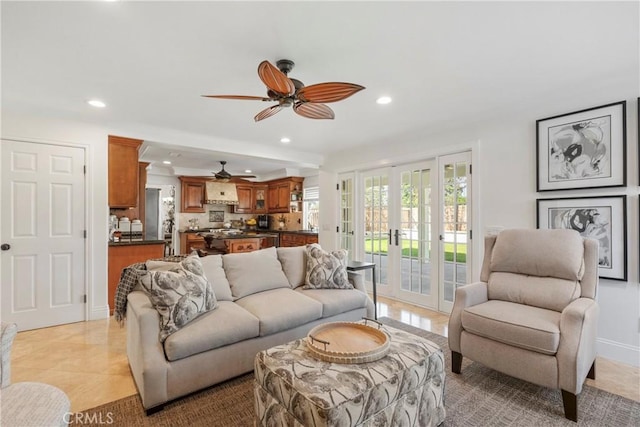 living room with light tile patterned floors, recessed lighting, baseboards, and french doors