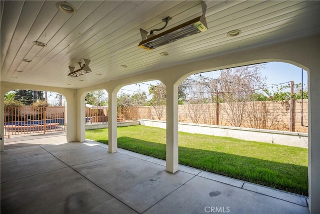 view of patio featuring a fenced backyard and a swimming pool