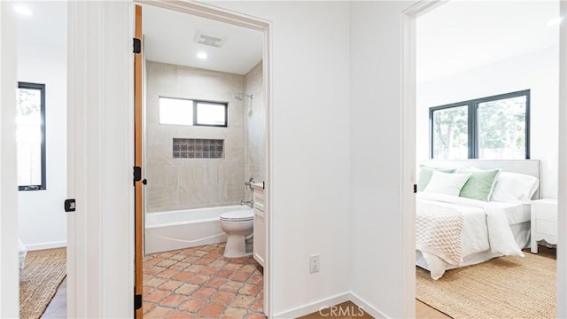 6652 Hough St, Los Angeles, CA 90042 - full bath with baseboards, toilet, tub / shower combination, connected bathroom, and tile patterned flooring