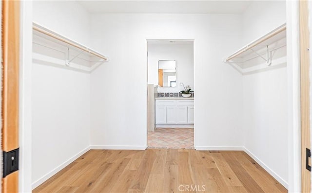 6652 Hough St, Los Angeles, CA 90042 - spacious closet featuring light wood finished floors
