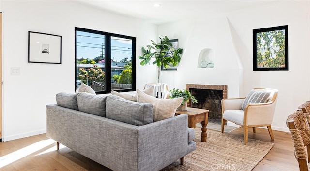 6652 Hough St, Los Angeles, CA 90042 - living area with recessed lighting, a fireplace, light wood finished floors, and baseboards