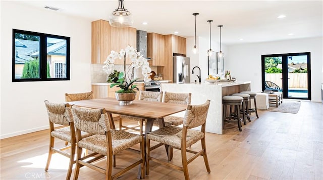6652 Hough St, Los Angeles, CA 90042 - dining area featuring light wood-style floors, recessed lighting, visible vents, and baseboards