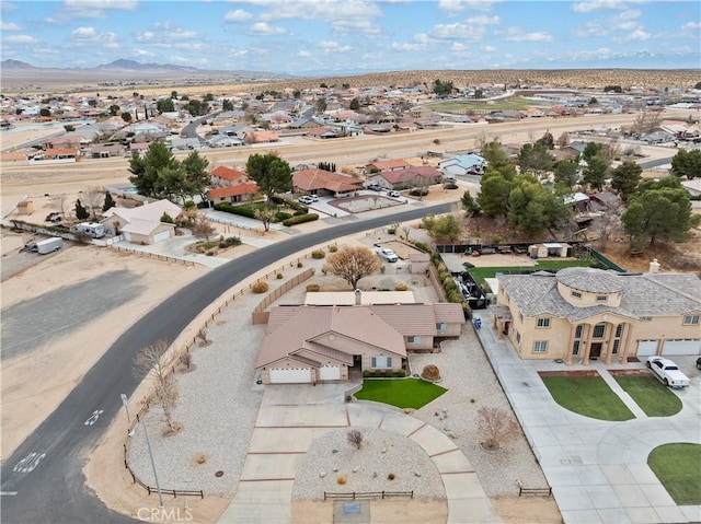 birds eye view of property with a residential view and a mountain view