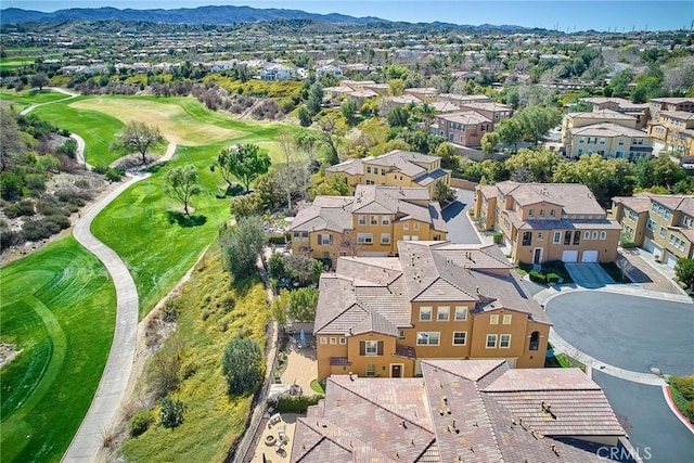 aerial view featuring a residential view, a mountain view, and golf course view