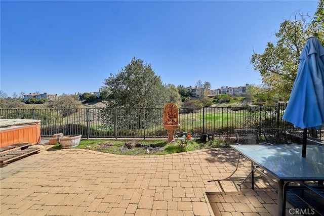 view of patio with outdoor dining space and a fenced backyard