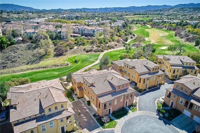 birds eye view of property with a mountain view, golf course view, and a residential view