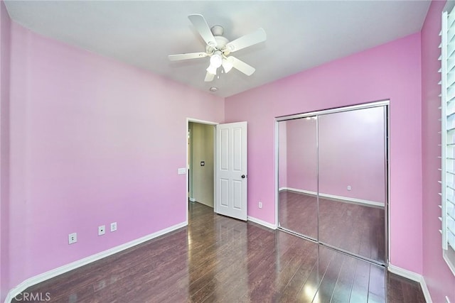 unfurnished bedroom with a ceiling fan, a closet, baseboards, and wood finished floors