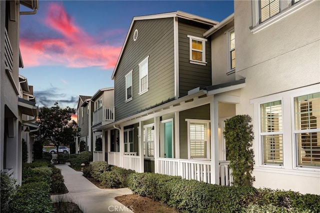 view of property exterior featuring a porch