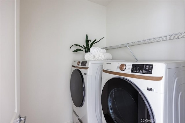 washroom featuring laundry area and independent washer and dryer