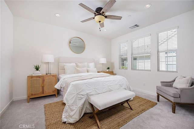 bedroom featuring recessed lighting, visible vents, a ceiling fan, light carpet, and baseboards