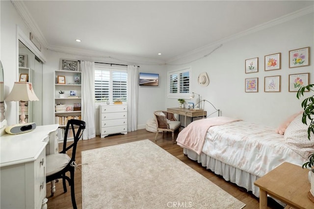 bedroom featuring ornamental molding, wood finished floors, and recessed lighting