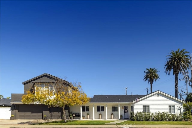 view of front of property with a garage and driveway