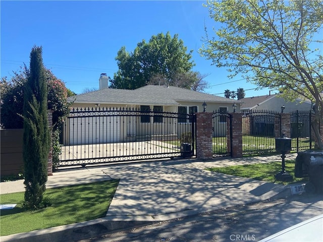 view of gate featuring a fenced front yard