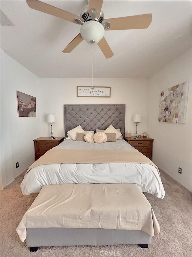 bedroom with carpet floors and a ceiling fan