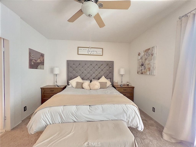 bedroom with light carpet and ceiling fan