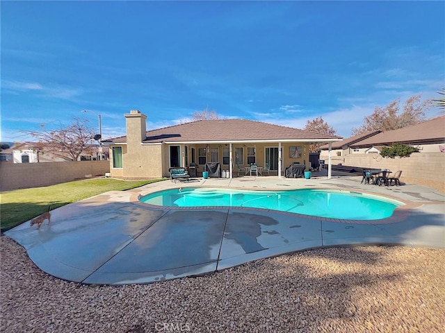 view of pool featuring a patio area, a fenced backyard, and a fenced in pool