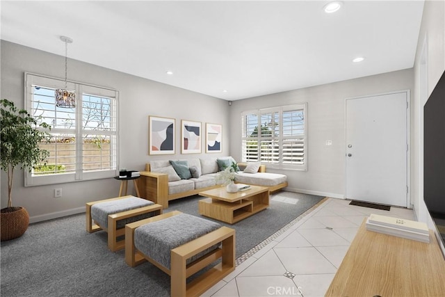 living area featuring light tile patterned floors, baseboards, and recessed lighting