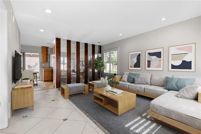 living room with light tile patterned floors, visible vents, and recessed lighting