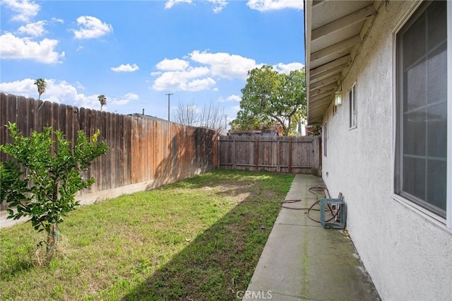 view of yard with a fenced backyard