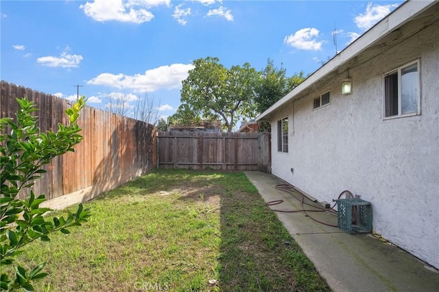 view of yard with a fenced backyard