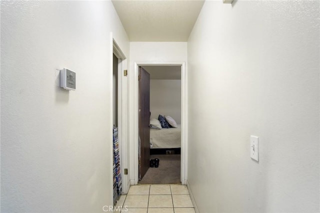 corridor featuring light tile patterned flooring